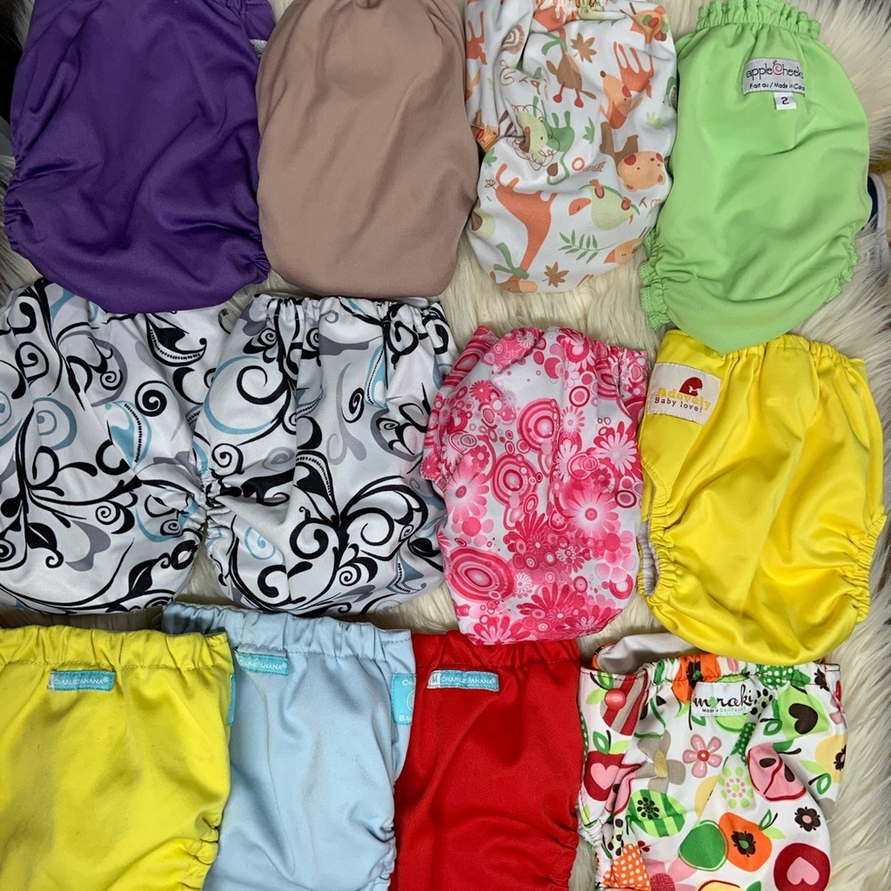 Bundle of 12 cloth diapers some a Charlie Banana